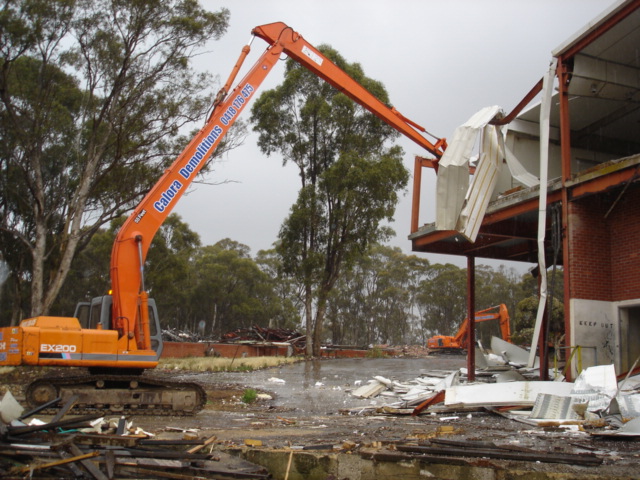 long reach excavator demolishing knackery