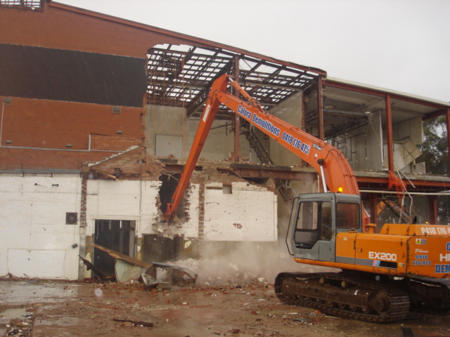 long reach excavator demolishing knackery
