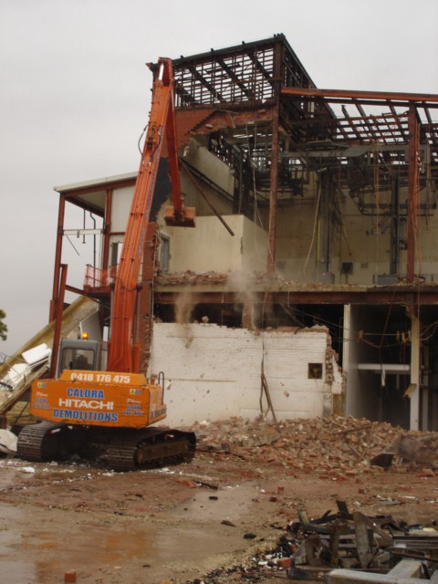long reach excavator demolishing knackery
